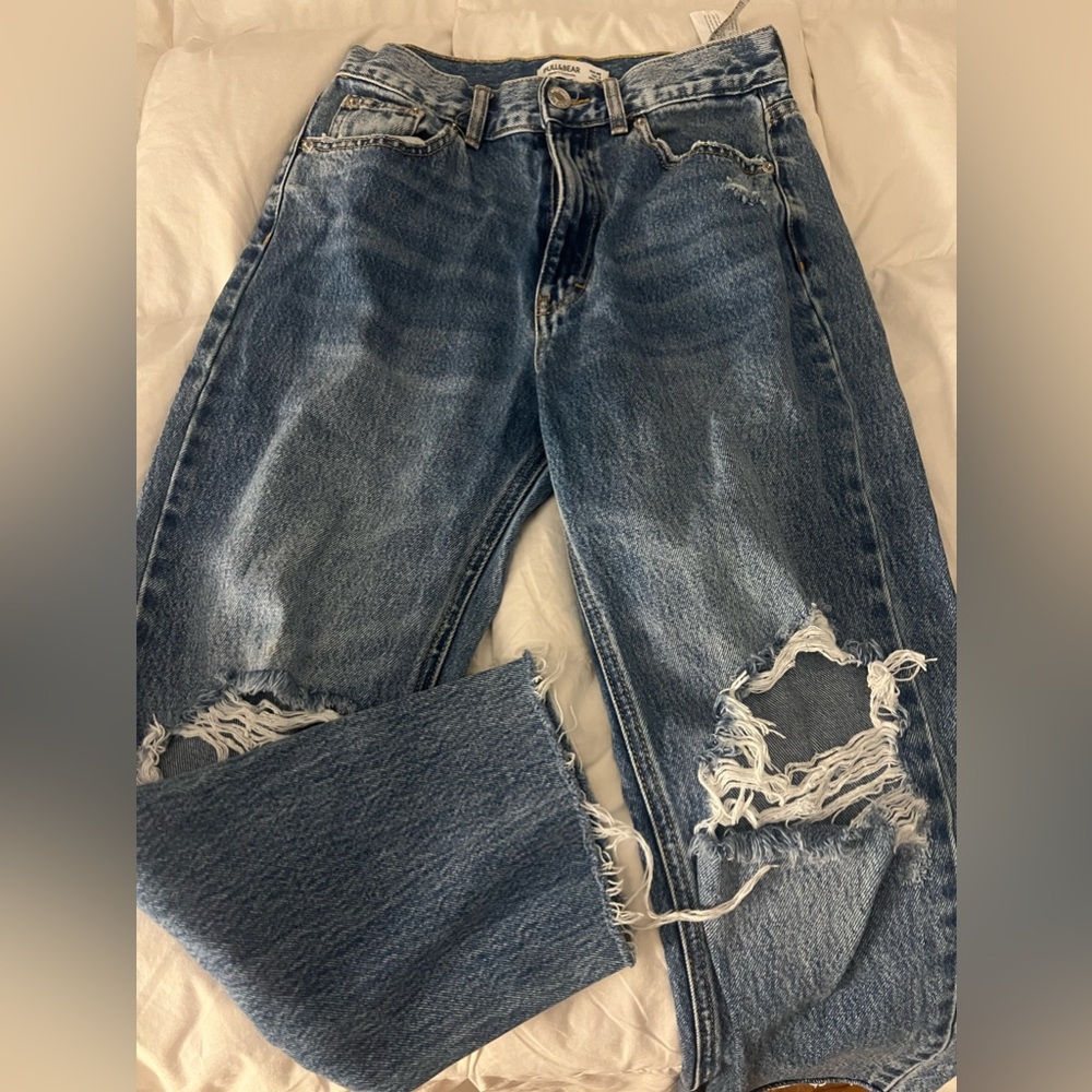 Dark wash straight leg ripped ankle jeans